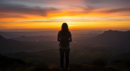 Woman Hiking Looking at Mountain Sunset View