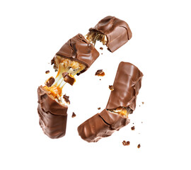 Two chocolate bars with nuts crushed in the air close up isolated on a white background