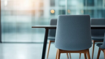 Coworking spaces, shared office and productivity, Modern office chair and table in a bright, minimalist workspace with glass walls and natural light.