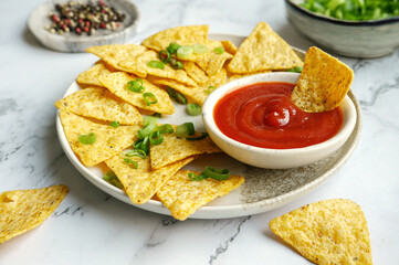 Crispy Mexican nachos tortilla served with a tomato dipping sauce.