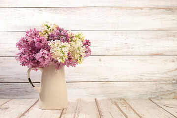 Abstract floral arrangement and banner for screen.Still life with beautiful spring flowers blooming white lilac in vase on elegant background,floral holiday card with summer greeting concept