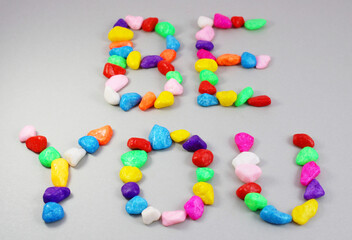 BE YOU, a message written with colorful stones