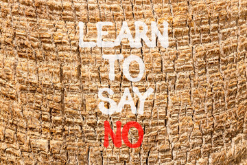 Learn to say no symbol. Concept words phrase Learn to say no on beautiful palm tree bark. Beautiful palm tree bark background. Business psychological Learn to say no concept. Copy space.