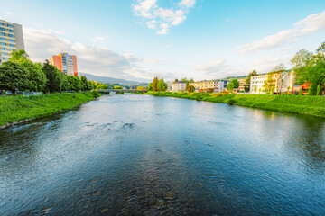 Obraz premium Wooden bridge with river in Dolny Kubin in orava region in summer