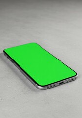 Green screen mobile device placed on textured surface, perfect for product mockups.