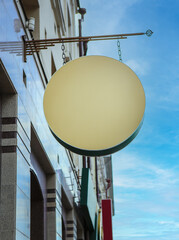 round sign on a bracket