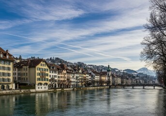 Scenic city view by river reflection on background