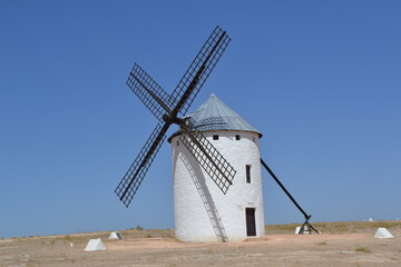 Historic windmill in la mancha, spain under clear blue skies. Campo de Criptana. La Mancha. Spain