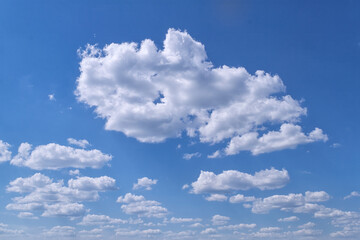 Summer clouds in blue sky in daylight
