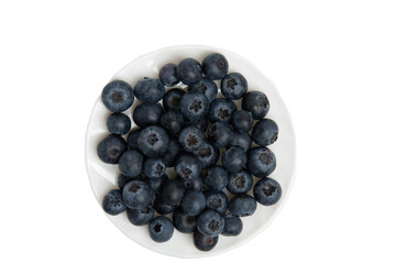 Dark blue ripe blueberries in a white ceramic bowl. Top view, transparent background, PNG format.