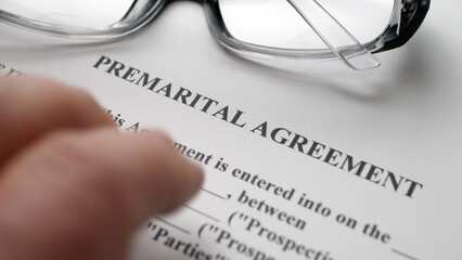 Finger tapping on premarital agreement