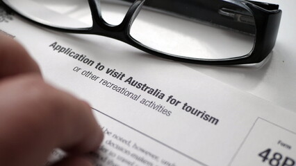 Finger tapping on application to visit australia