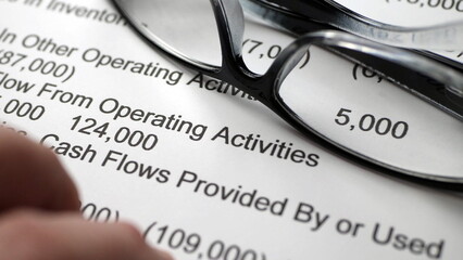 Finger tapping on financial report