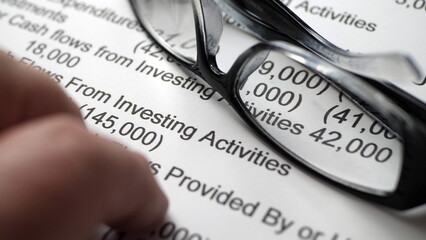 Finger tapping on financial report