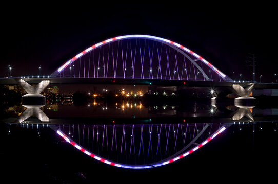 lowry avenue or  county highway 153 bridge spanning mississippi river connecting north to northeast minneapolis neigborhoods illuminated at night