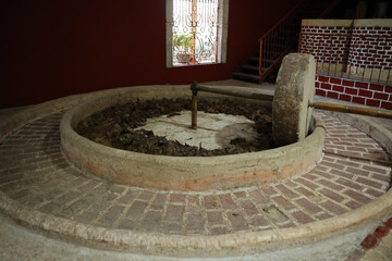 Old traditional stone machine for making tequila from agave, Yucatan, Mexico