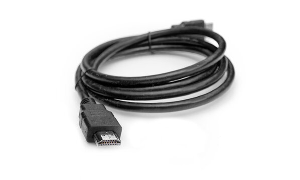 Black hdmi cable coiled on white background
