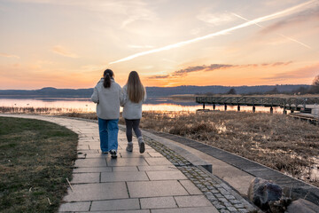 Walk along the promenade. A walk by the sea. Walking in nature. Sunset.