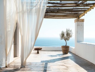 A white curtain is open on a balcony overlooking the ocean. A potted tree is on the balcony