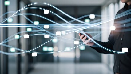 A person uses a smartphone in a modern office, with digital network connections visualized as flowing data streams.
