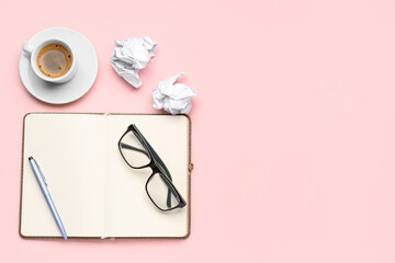 Obraz premium Composition with notebook, eyeglasses, crumpled paper balls and cup of coffee on pink background