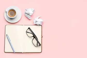 Gordijnen Composition with notebook, eyeglasses, crumpled paper balls and cup of coffee on pink background © Pixel-Shot