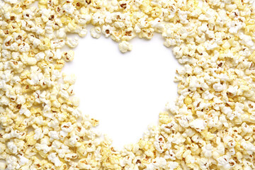Heart made of crispy popcorn on white background