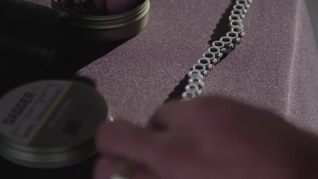 Close up of loading air gun pellet magazine