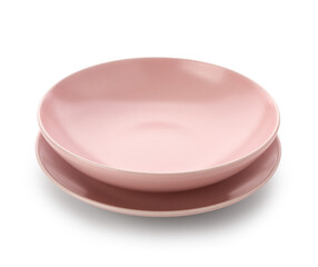 Pink ceramic plates on white background