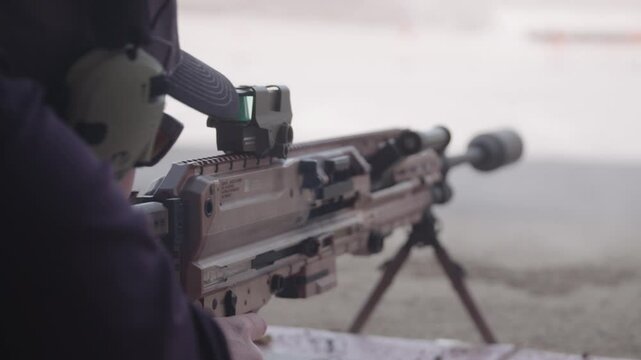 Close up of machine gun shooting at range