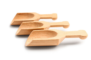 Set of wooden scoops isolated on white background