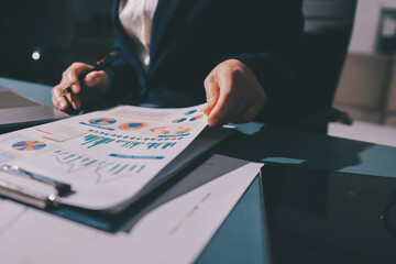 Expert woman asian female people review data number costing managerial account prepare monthly...