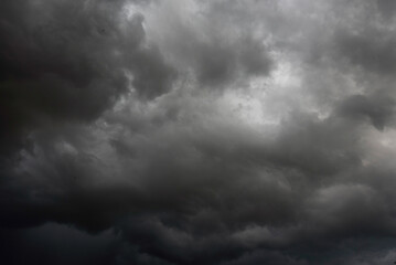 Dramatic dark storm thundercloud rain clouds on black sky background. Dark thunderstorm clouds rainny landscape. Meteorology danger windstorm disaster climate. Dark cloudscape storm disaster gray sky