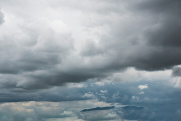 Dramatic dark storm thundercloud rain clouds on black sky background. Dark thunderstorm clouds...