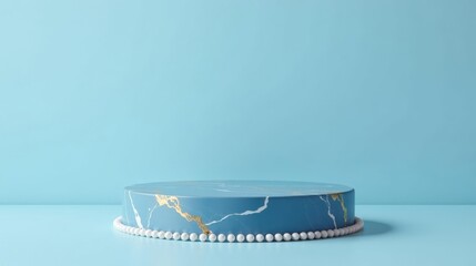 Elegant Blue Marble Display Pedestal with Pearl Accents on Light Blue Background