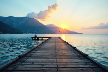 Serene Sunset Vista Wooden Dock Extending Towards a Tranquil Lake at Dawn with Majestic Mountain Silhouette