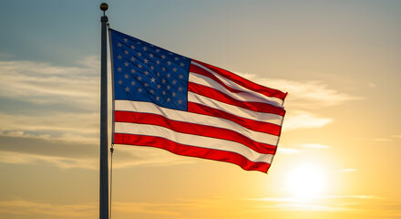 American flag waving at sunset