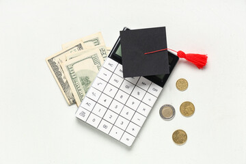 Graduation hat with calculator and money on white background. Tuition fees concept