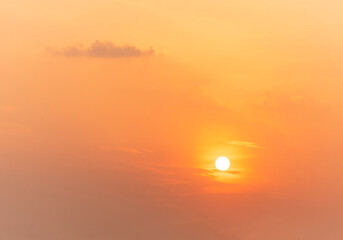 Spectacular sunrise on the horizon with the sea at your feet. Romantic sunrise. Beach sunrises. The sun tries to rise through the clouds in the orange sunrise. Travel and landscape concept.