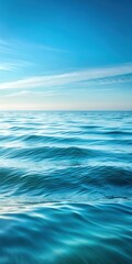 Soft ocean waves with gentle light blue gradient background and subtle foam ripples on the surface of calm sea