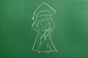 Drawn female graduate with diploma on green chalkboard