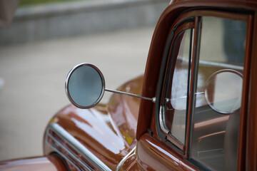Close-Up of Vintage Car's Side Mirror and Window Details