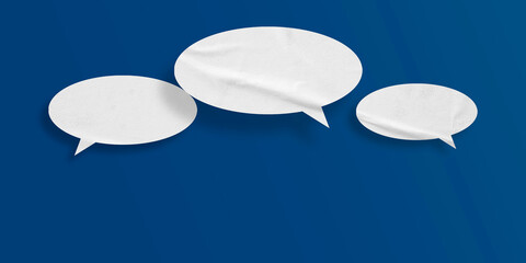 White speech bubble crumpled paper isolated on blue background