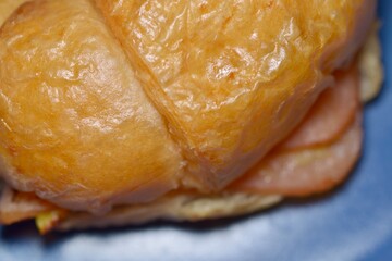 Freshly baked butter croissant with crisp layers and soft center.