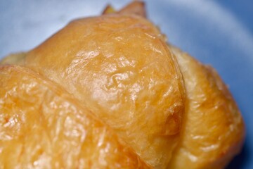 Morning breakfast with hot coffee and fresh croissant