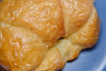 Croissant served with jam and fresh berries for a gourmet breakfast.