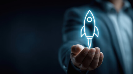 A businessman holds a glowing rocket icon, symbolizing startup, innovation, and launching new business ventures.