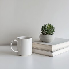 Fototapeta premium Minimalist still life of a white mug, succulent in a grey pot, and two stacked books on a white surface against a light grey wall
