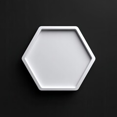 A white hexagonal tray or coaster with a raised border sits on a dark background.  Clean lines and minimalist design
