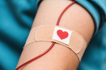 Close-up of Blood Donation IV With Heart Symbol